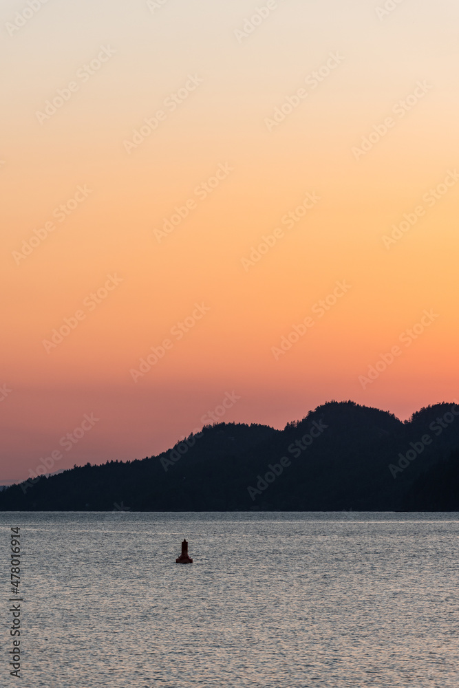 View from Saturna Island dock of silhouetted Southern Gulf Islands at sunset
