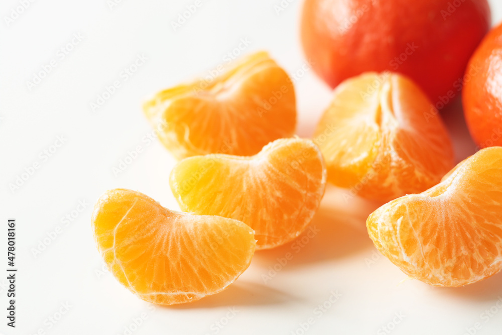 unpeeled slices of yellow mandarin unpeeled slices of yellow mandarin