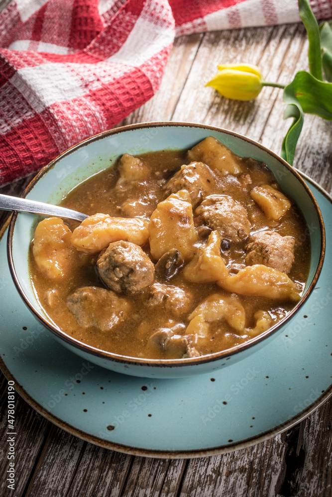 Meatballs in gravy with cast noodles. Meatballs in gravy with cast noodles.