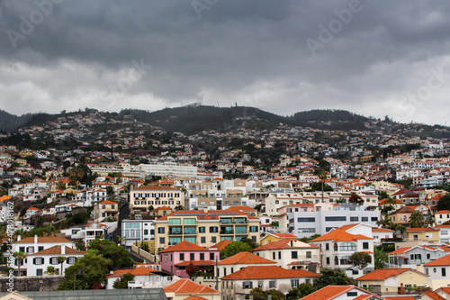 View of the city of Funchal, Madeira Mountains and houses on the background. © Sergiodesilva
