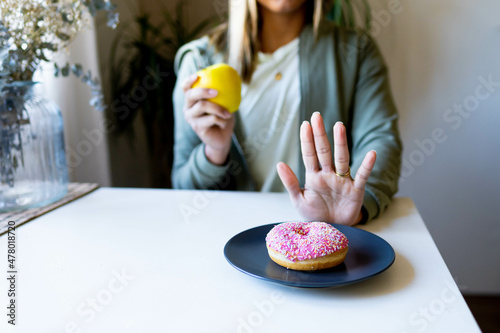 dieting woman rejecting junk food