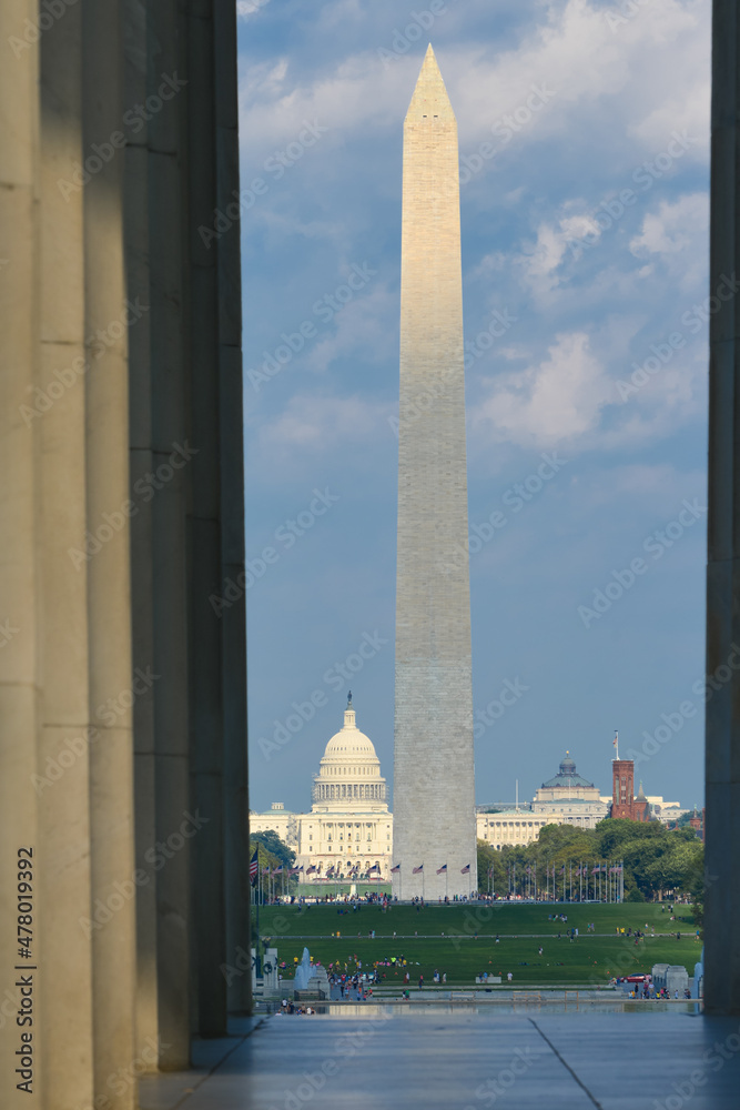 Washington DC monuments including the Capitol and Washington Monument as seen between columns of Lincoln Memorial
