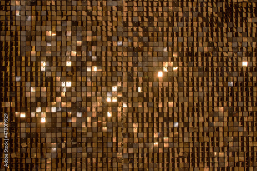 Beautiful abstract sparkles glitter background. Glittering sequins on the wall photo