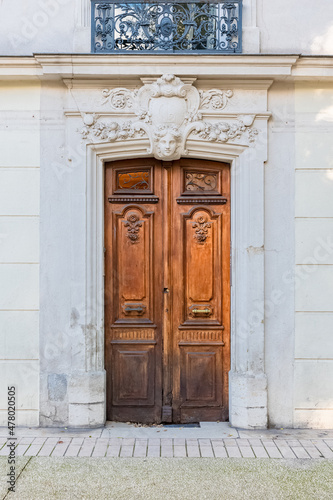 Nimes in France, old facades in the historic center, beautiful wooden door
