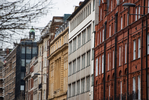 Perspective of old apartment buildings in London photo