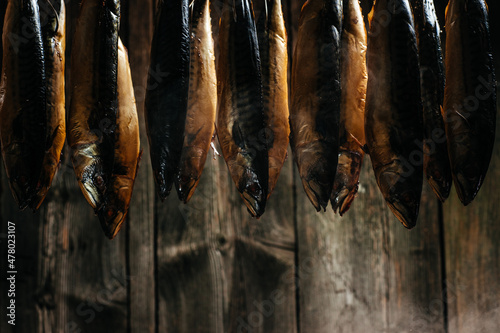 Fish Smoking Process For Home Use. fish hanging side by side in a smoker. Smoked Mackerel. Smoking Process Fish In Smokehouse