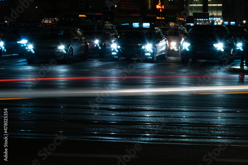 Cars in the Busy Streets of a Big City at Night