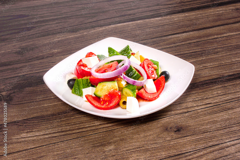Healthy food Greek Salad with fresh vegetables, diet portion