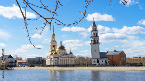 Canvas Leaning Tower of Nevyansk and Old Believers' church (domed) in spring day on the