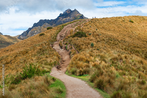 Walking path to the Rucu Pichincha volcanic peak with the silhouette of people doing the hike on the Pichincha volcano, Quito, Ecuador.