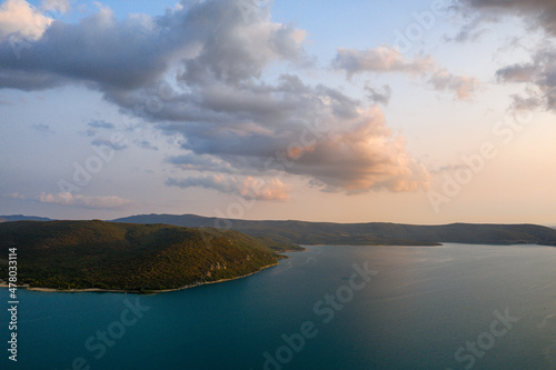 The Lake of Sainte-Croix and the clouds of the sunset in Europe, in France, Provence Alpes Cote dAzur, in the Var, in summer.
