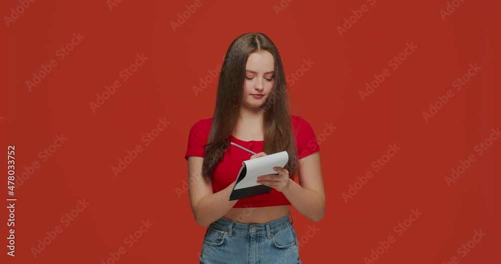 Pensive young girl make notes on notebook, do task, write down important data information, creative start up ideas Pensive young girl make notes on notebook, do task, write down important data information, creative start up ideas
