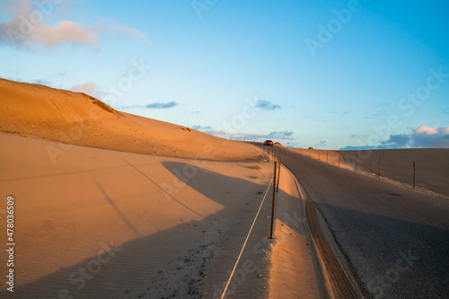 The road through sand dunes at sunset in Guadalupe-Nipomo Dunes National Wildlife reserve, California