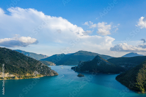 The Lac de Castillon and its green vegetation in Europe, in France, Provence Alpes Cote dAzur, in the Var, in summer, on a sunny day.