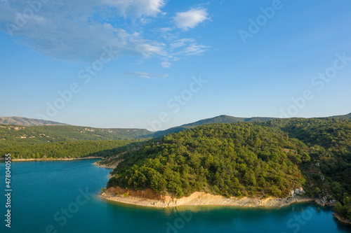 The riverbanks with forests on the Lac de Sainte-Croix in Europe, France, Provence Alpes Cote dAzur, in the Var, in the summer, on a sunny day.