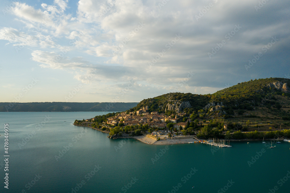 The town of Bauduen at the edge of the lake of Sainte Croix at sunset in Europe, in France, Provence Alpes Cote dAzur, in the Var, in summer.