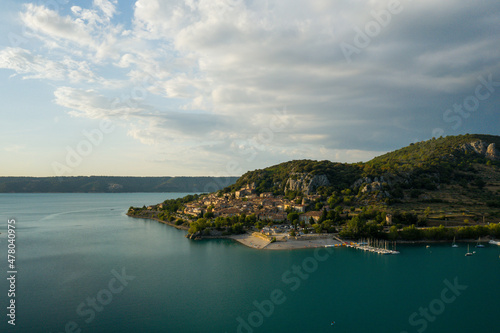 The town of Bauduen at the edge of the lake of Sainte Croix at sunset in Europe, in France, Provence Alpes Cote dAzur, in the Var, in summer.