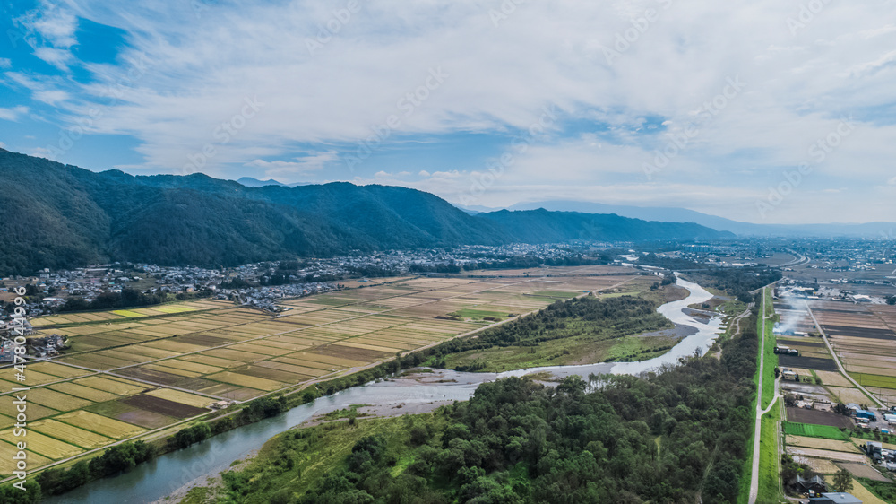 Drone shot above Daio Wasabi Farm showcasing the mountain ranges. Azumino Nagano Japan