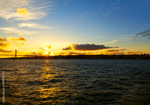 Fototapeta Naklejka Na Ścianę i Meble -  Evening at Tagus river in Lisbon . Portuguese sunset scenery 