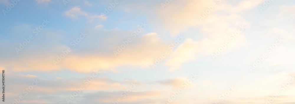 Clear blue sky. glowing pink and golden cirrus and cumulus clouds after storm, soft sunlight. Dramatic sunset cloudscape. Meteorology, heaven, peace, graphic resources, picturesque panoramic scenery - obrazy, fototapety, plakaty 