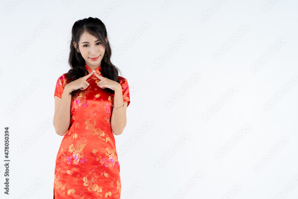 beauty woman wear cheongsam and smile to you in chinese new year beauty woman wear cheongsam and smile to you in chinese new year