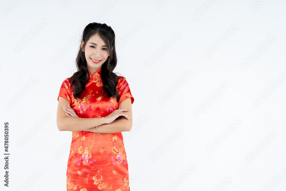 beauty woman wear cheongsam and smile to you in chinese new year beauty woman wear cheongsam and smile to you in chinese new year