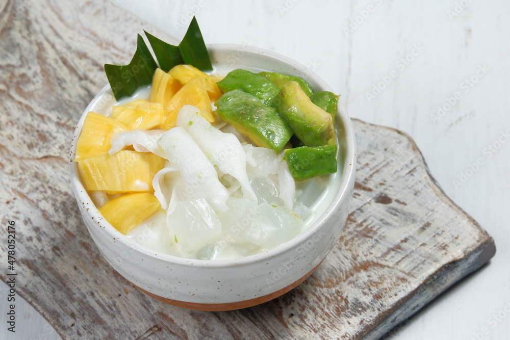 Ice teler or es teler-indonesian fruit cocktail,Avocado, young coconut, jackfruit, served with coconut milk, sweetened condensed milk. Ice teler or es teler-indonesian fruit cocktail,Avocado, young coconut, jackfruit, served with coconut milk, sweetened condensed milk.