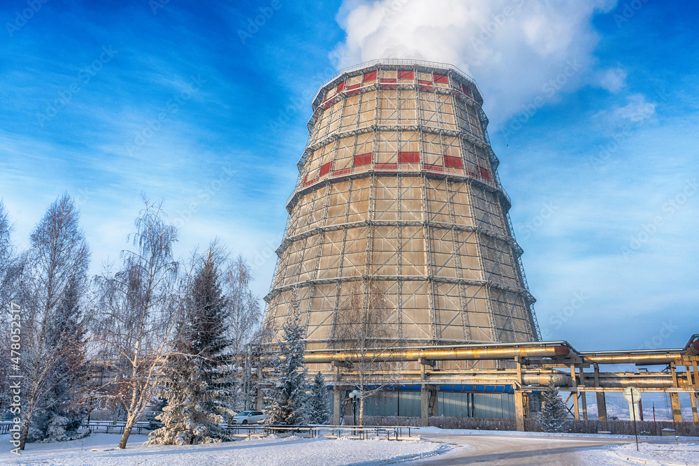 Territory of heat and power station. Accumulator tanks and cooling towers. Winter	