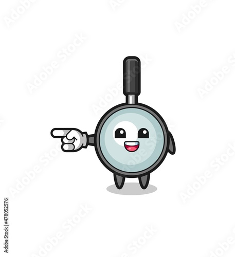 magnifying glass cartoon with pointing left gesture