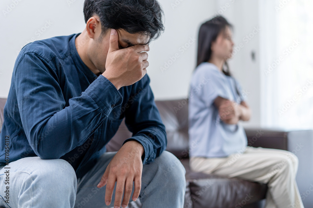 Asian man are disappointed and saddened after an argument with wife. Asian couples are having family problems resulting in divorce. Lover broken and Love problem Asian man are disappointed and saddened after an argument with wife. Asian couples are having family problems resulting in divorce. Lover broken and Love problem