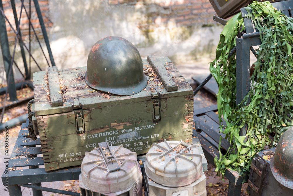 Old metal Helmet  Of Infantry Soldier on wooden box. Old military helmet from the Second World War, with scratches and rust.