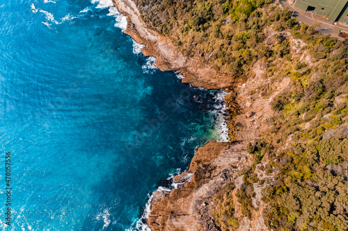 Stylized Long Exposure Drone Shot of Shelly Headland Waves © Overflightstock