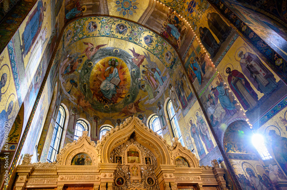 Carved altar ornament and dome decorated with frescoes in the Church of the Savior on Spilled Blood in St. Petersburg, Russia
