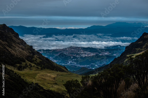 mountains and clouds and city