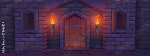 Medieval castle gate at night, palace entry exterior with arched door and burning torches. Fortress tower architecture, fairytale dungeon building facade, stone brick wall, Cartoon vector illustration