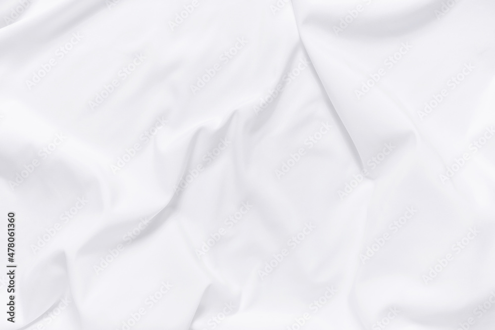 Naklejka premium Abstract white fabric texture background. Cloth soft wave. Creases of satin, silk, and cotton.