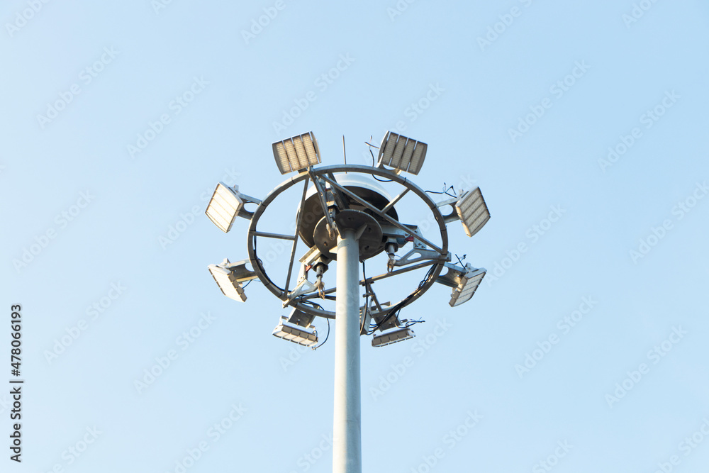 Spotlight pole sky and cloud on background. It is a technology that provides light in a wide area. Beautifully shaped set in a park to illuminate the night.concept of safety on roads or park. Spotlight pole sky and cloud on background. It is a technology that provides light in a wide area. Beautifully shaped set in a park to illuminate the night.concept of safety on roads or park.