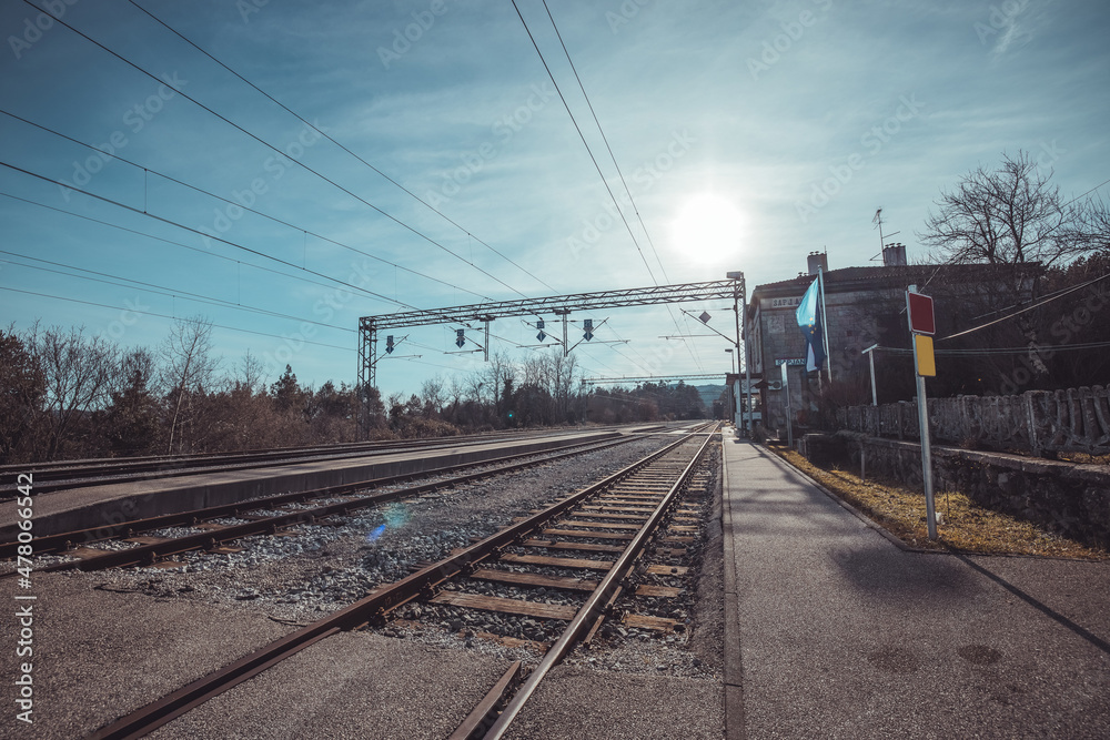 Border train station of Sapjane bathing in a warm winter sun. Empty train station on border between Croatia and Slovenia. Border train station of Sapjane bathing in a warm winter sun. Empty train station on border between Croatia and Slovenia.