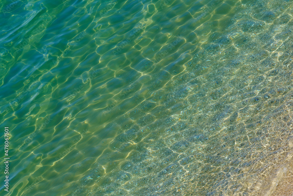 Top view of the transparent sea surface near the beach Top view of the transparent sea surface near the beach