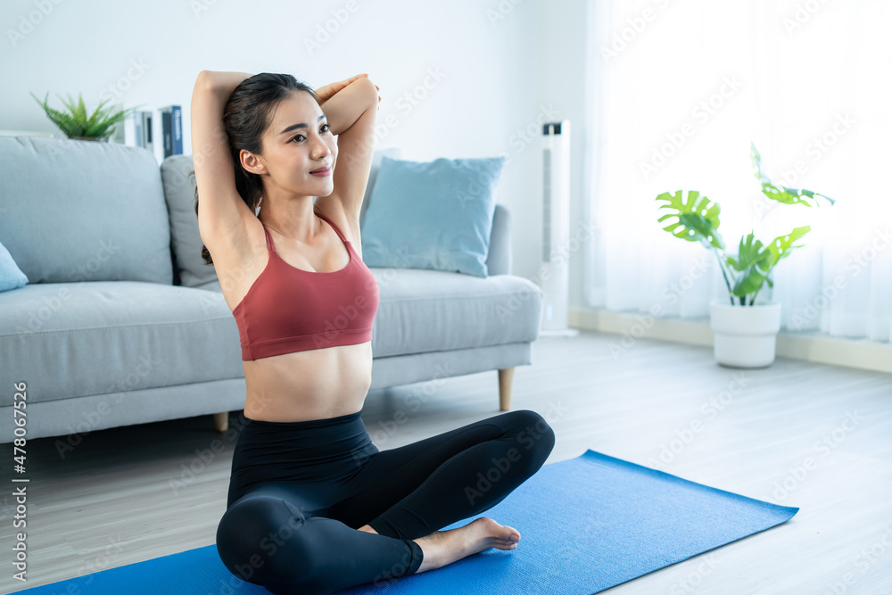 Asian young beautiful active woman doing Yoga Pilates workout at home. Asian young beautiful active woman doing Yoga Pilates workout at home.
