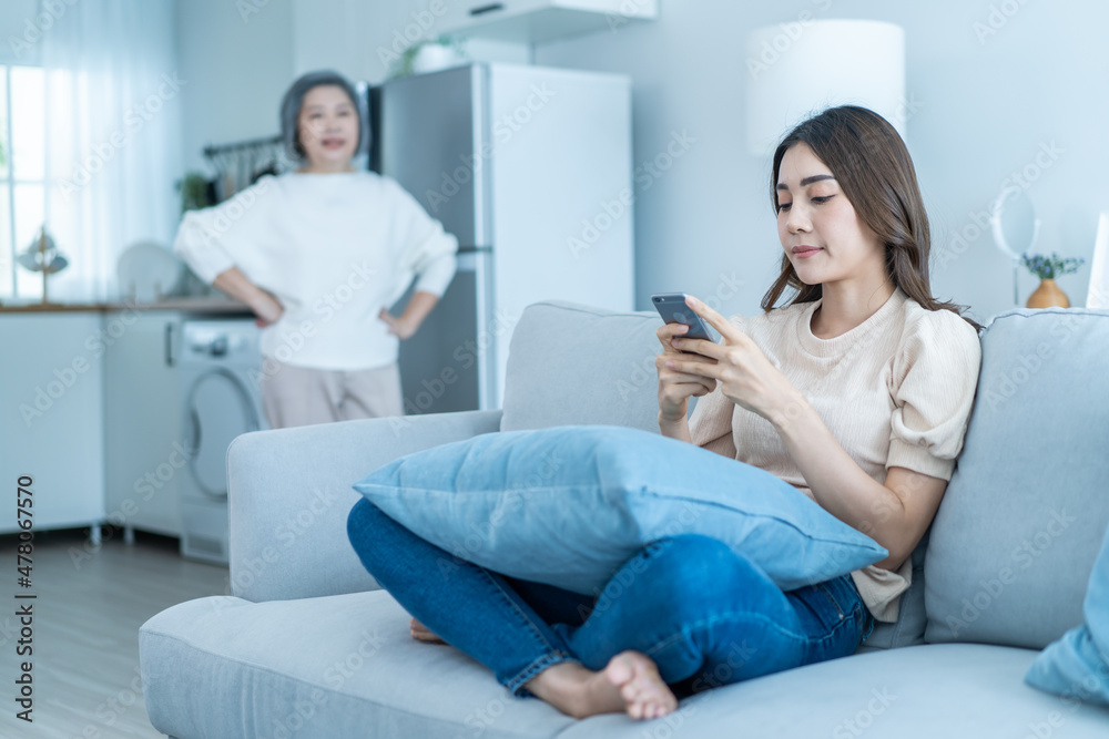 Asian angry senior mature woman shouting at stubborn fussy daughter. Asian angry senior mature woman shouting at stubborn fussy daughter.