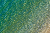 Top view of the transparent sea surface near the beach