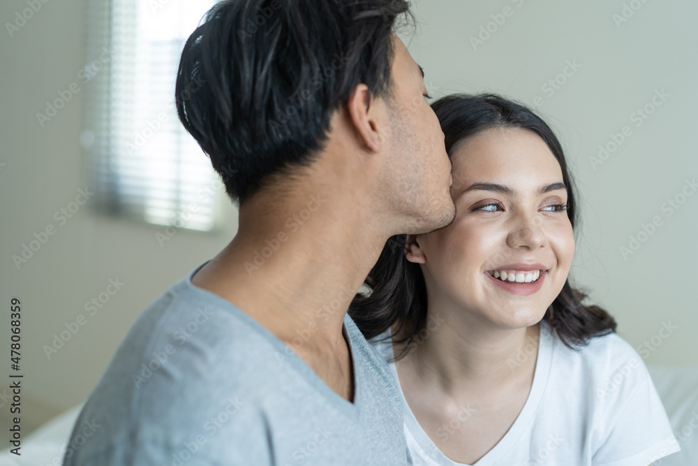 Asian attractive couple sitting together after wakeup in the morning. Asian attractive couple sitting together after wakeup in the morning.