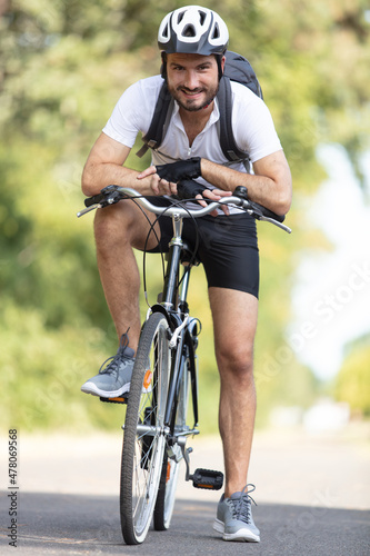 sporty cyclist rides a bicycle on the road © auremar