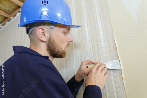 a builder plastering a wall
