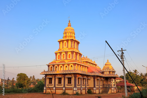 Shri Siddhivinayak Ganesh temple with majestic Goan architecture is situated in Candolim, Goa, India. photo
