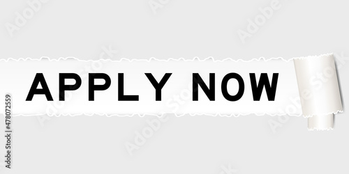 Ripped gray paper background that have word apply now under torn part