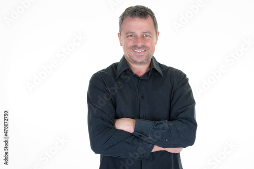 confident middle aged man standing on white background