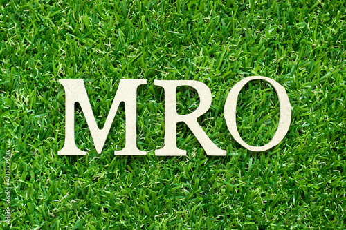 Alphabet letter in word MRO (Abbreviation of Maintenance, repair and overhaul or Maintenance, Repair and Operations) on green grass background