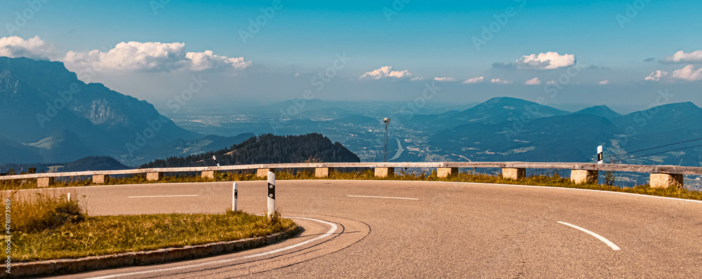 Fototapeta premium Beautiful alpine summer view with the city of Salzburg in the background at the famous Rossfeldstrasse panorama street, Bavaria, Germany
